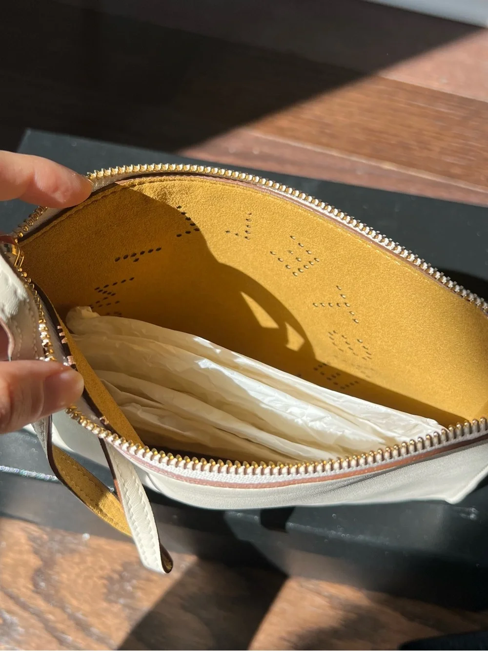 Stella McCartney Cream Perforated Logo Wristlet Clutch